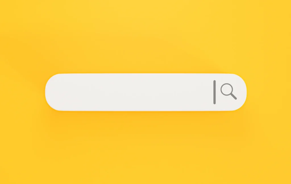 a yellow background with a white search bar in the foreground